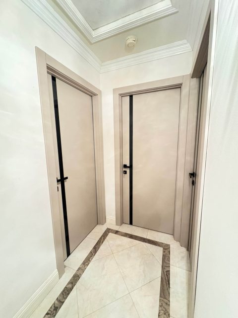 YL-G beige interior doors complement the classic architectural details of the hallway