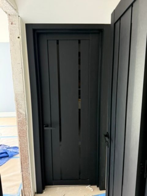 Side view showing door profile and frame detail during installation
