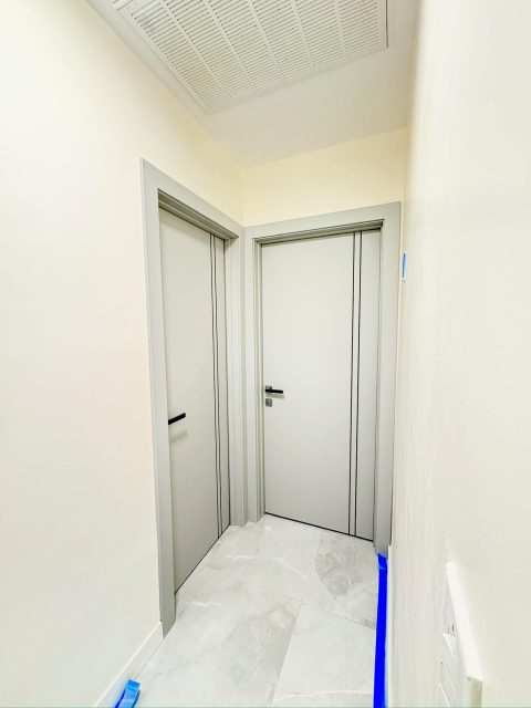 YL-H white interior doors installed in a modern hallway