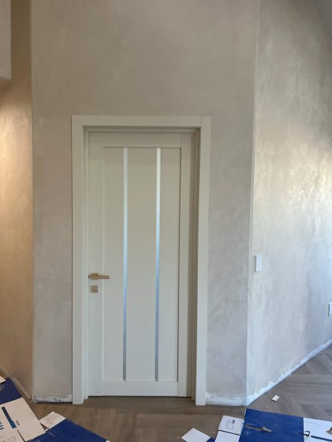 LV-04 Magnolia in a room with high ceilings and herringbone oak flooring